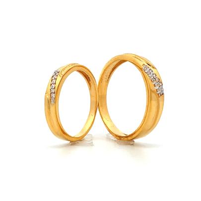 CONTEMPORARY GOLD AND DIAMOND COUPLE RINGS  Gold