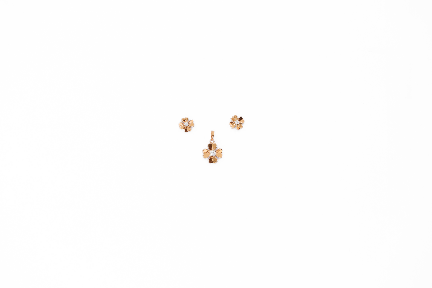 Pair of gold earrings on a white background