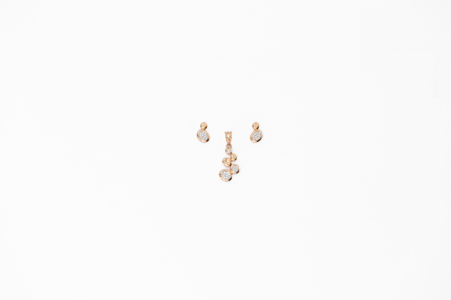 Pair of gold earrings on a white background