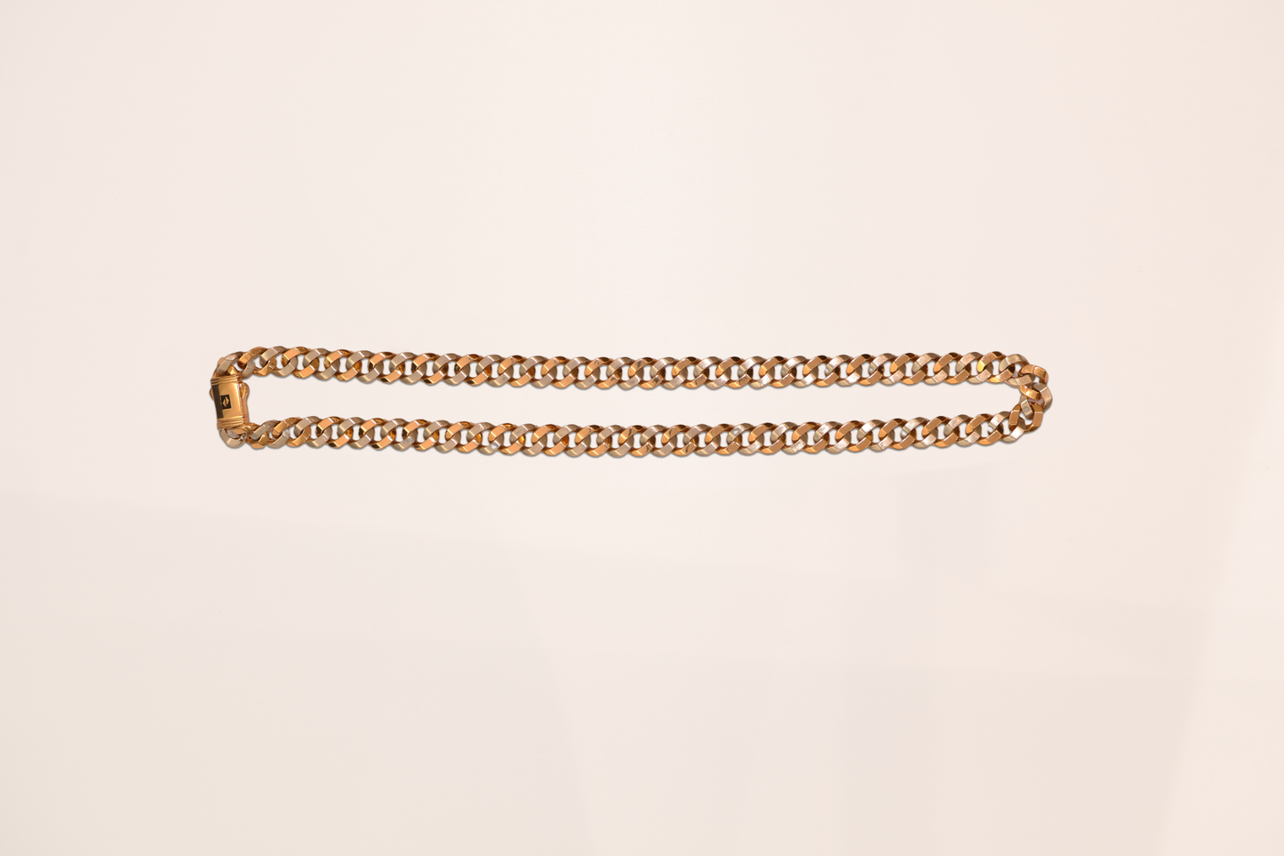 Gold chain belt on a beige background