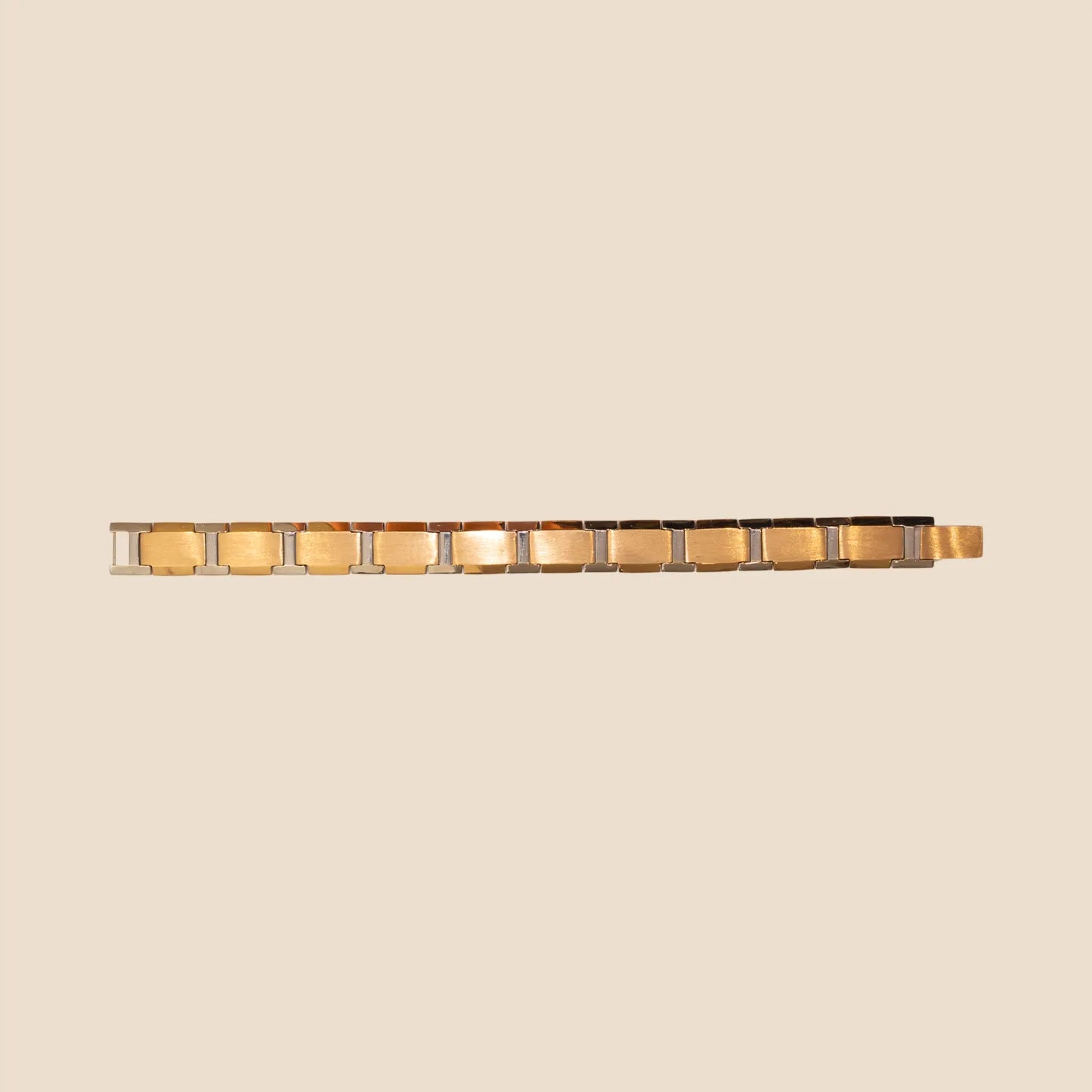 Decorative wall sconce with gold accents on a beige background
