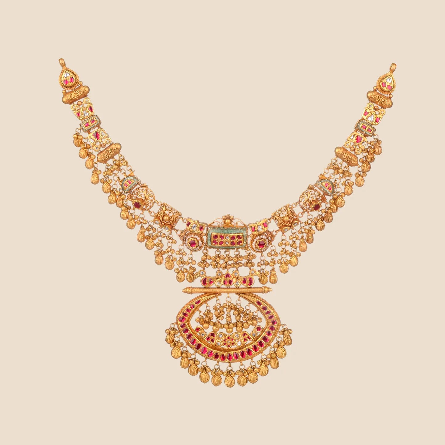 Ornate gold choker necklace featuring a central rectangular motif and a large crescent pendant detailed with red stones and hanging gold drops.