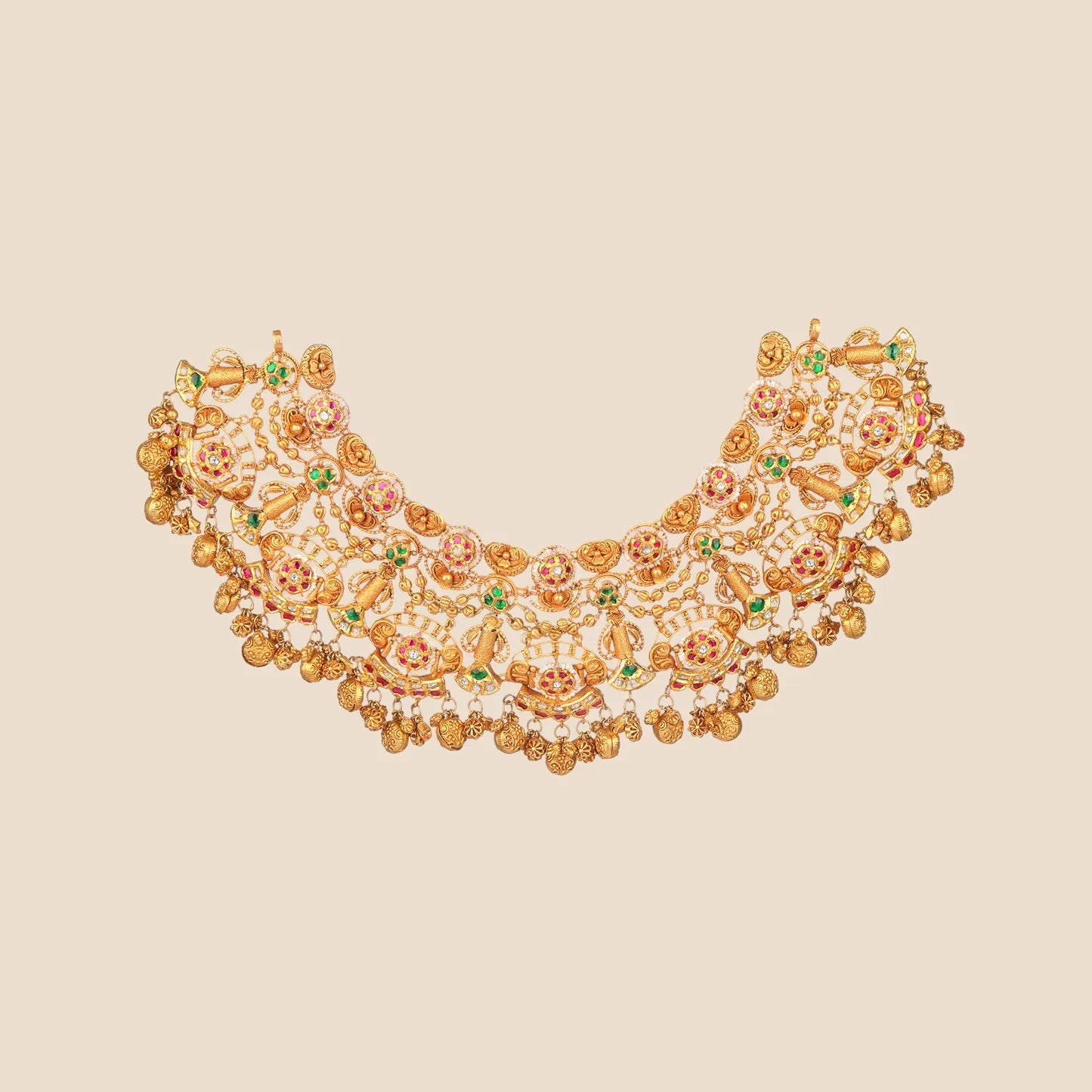 Intricate heavy gold choker necklace adorned with red and green stones, pearl details, and multiple dangling gold elements.