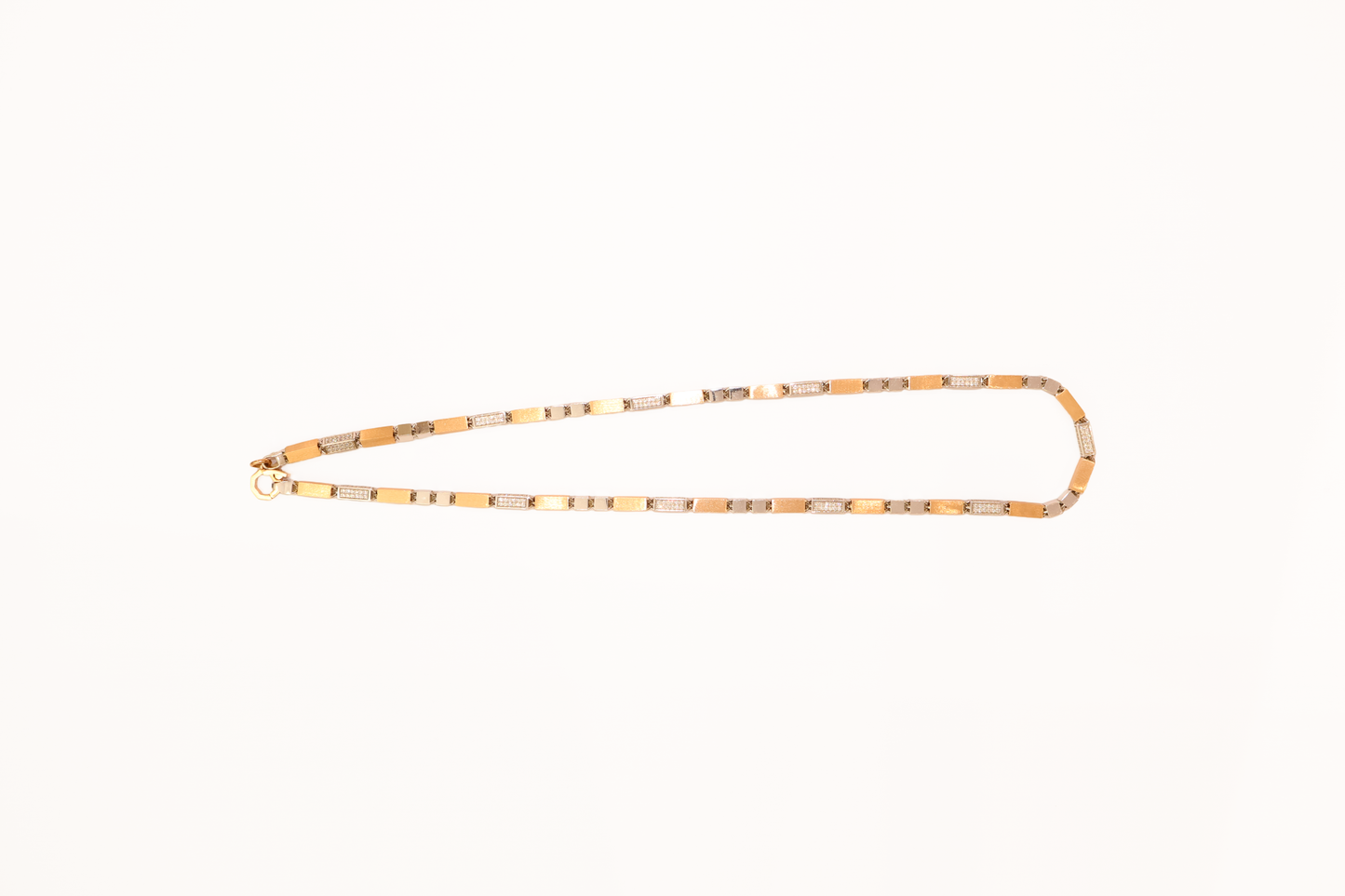 Gold chain necklace on a white background