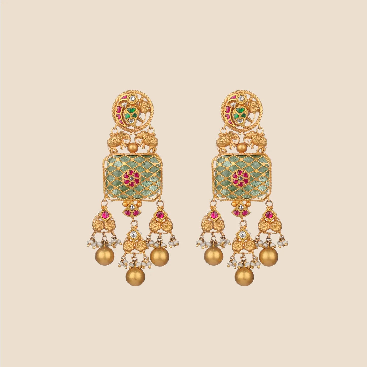 Ornate gold dangle earrings featuring a rectangular green stone with gold lattice overlay, tiny elephant motifs, red stone accents, and dangling gold spheres with pearls.