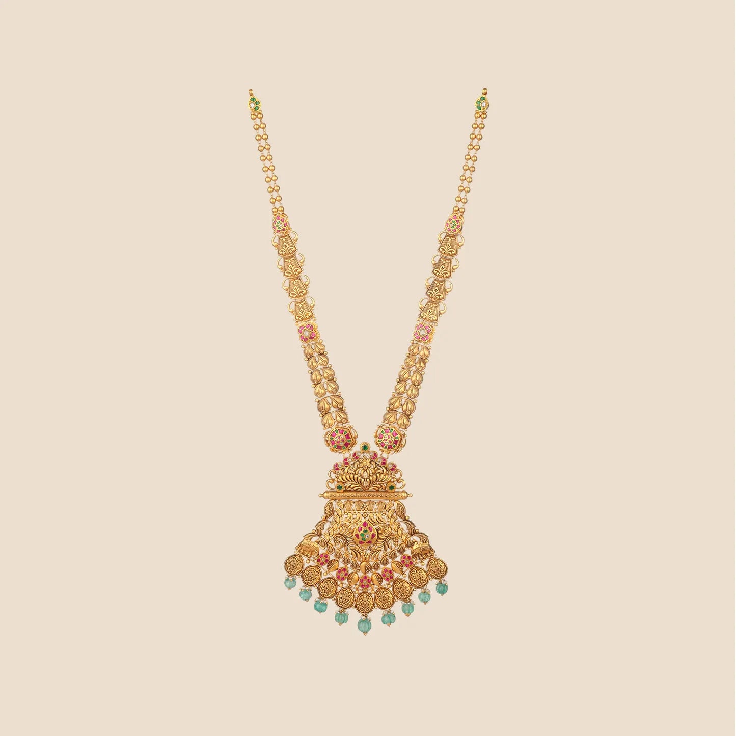 Long traditional gold necklace featuring a detailed chain and a large, intricate pendant adorned with pink and green stones and cascading light green bead drops.