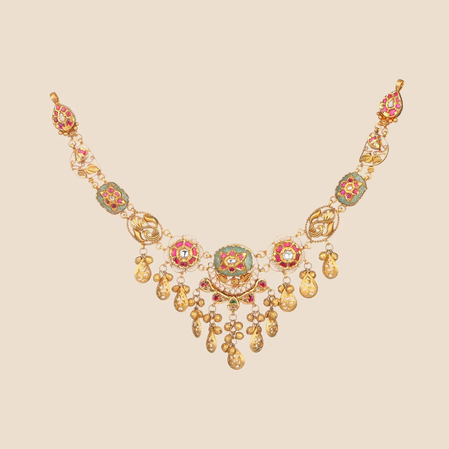 Gold choker necklace with emerald and ruby accents, floral motifs, and dangling teardrop charms.