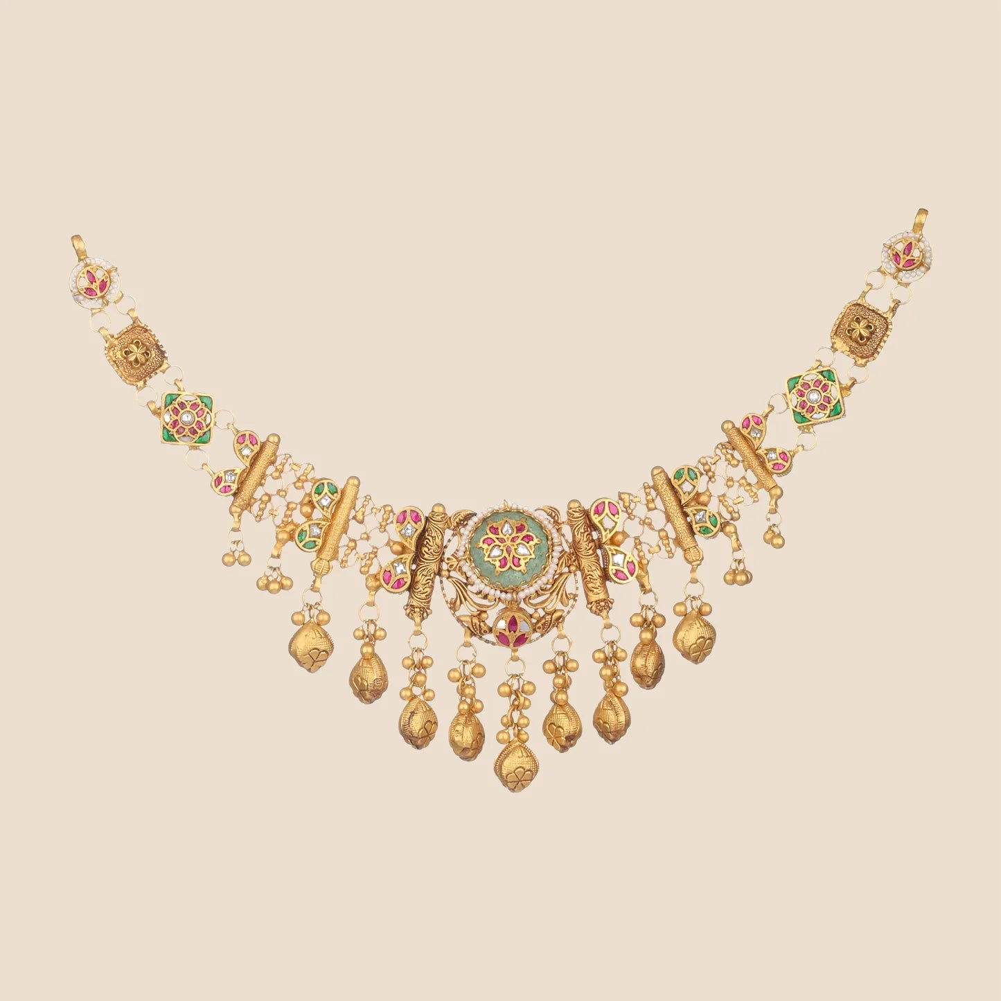 Gold temple choker necklace with emerald enamel medallion, pink detailing, and dangling drops.