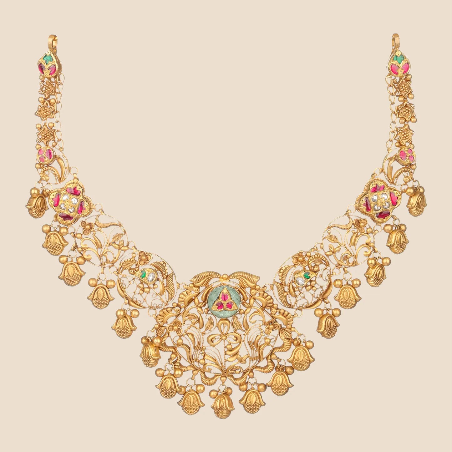 Gold filigree choker necklace with pink and green stone accents and dangling bell charms.