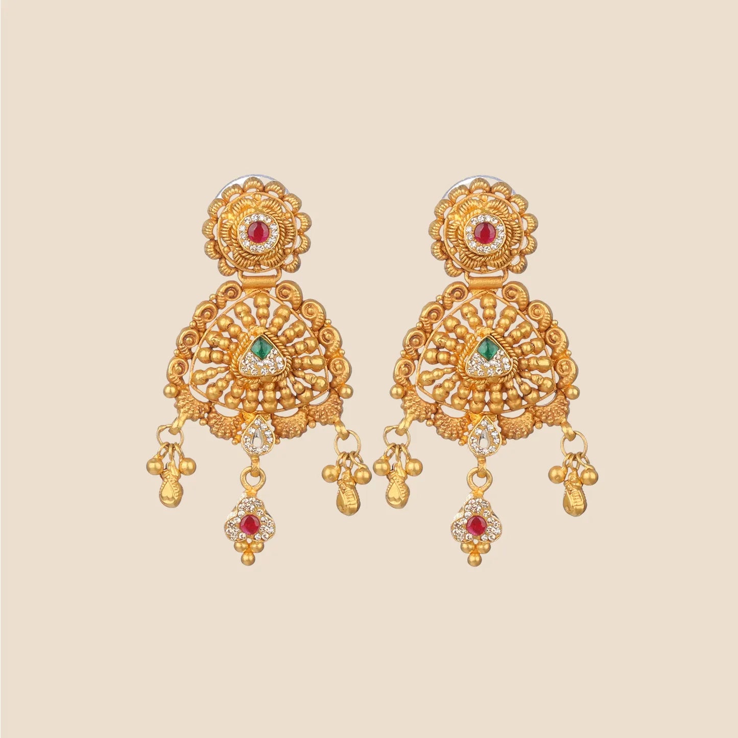 Pair of gold dangle earrings featuring intricate filigree work, a circular top with a red stone, and a detailed semi-circular drop with a central green stone and hanging gold beads.