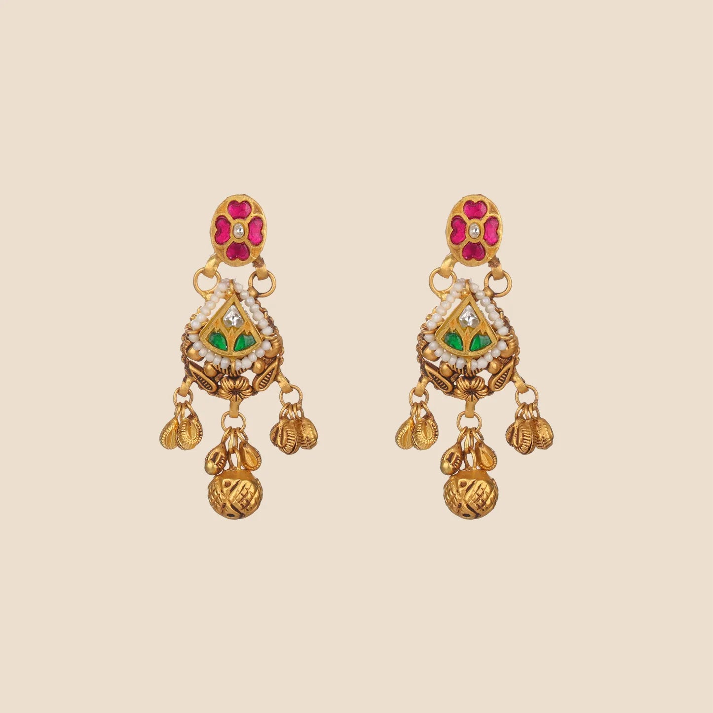 Ornate gold dangle earrings featuring a pink floral stud, a pearl-bordered triangular center with green and clear stones, and dangling textured gold beads.