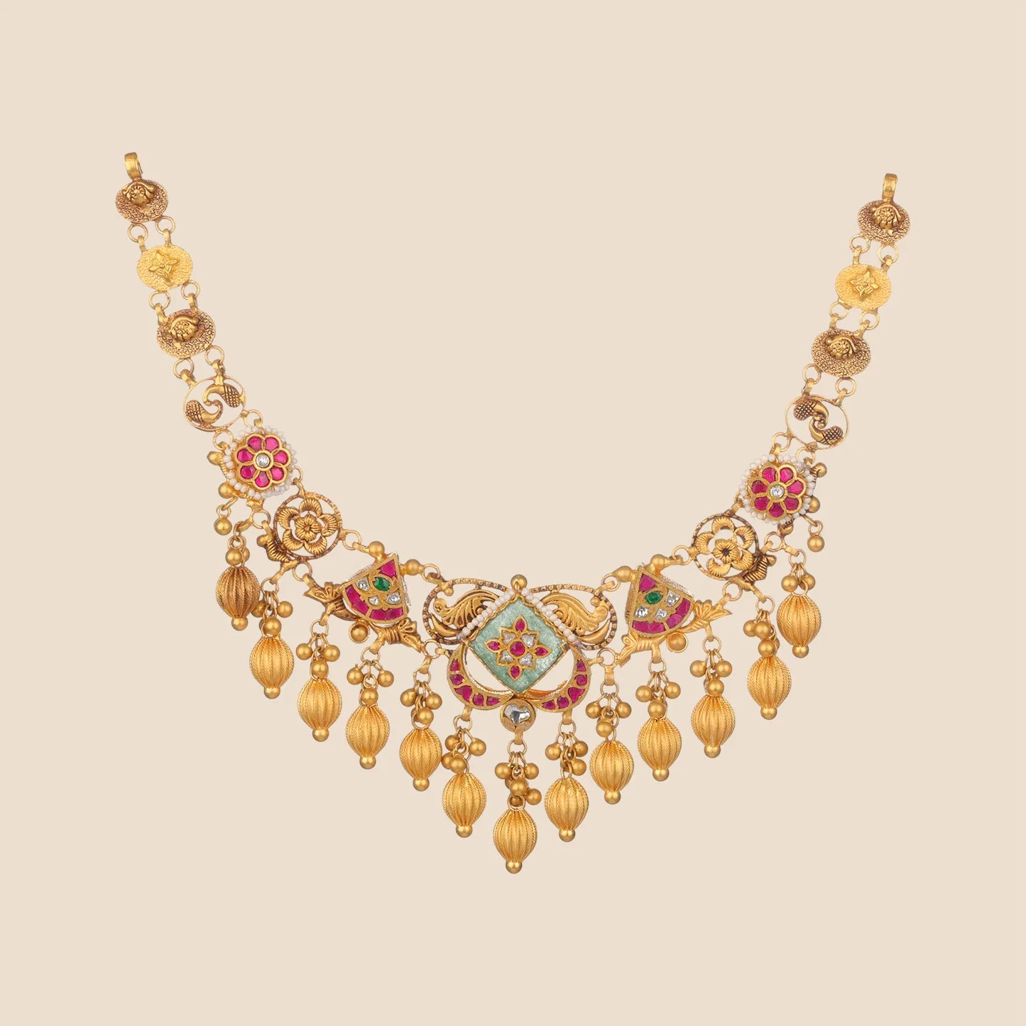 An elegant gold choker necklace with a central diamond-shaped floral pendant, ruby pink stone accents, and multiple dangling gold bead drops.
