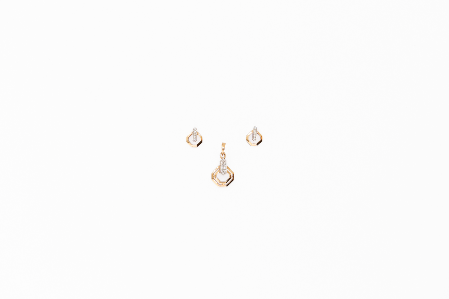Set of gold earrings on a white background