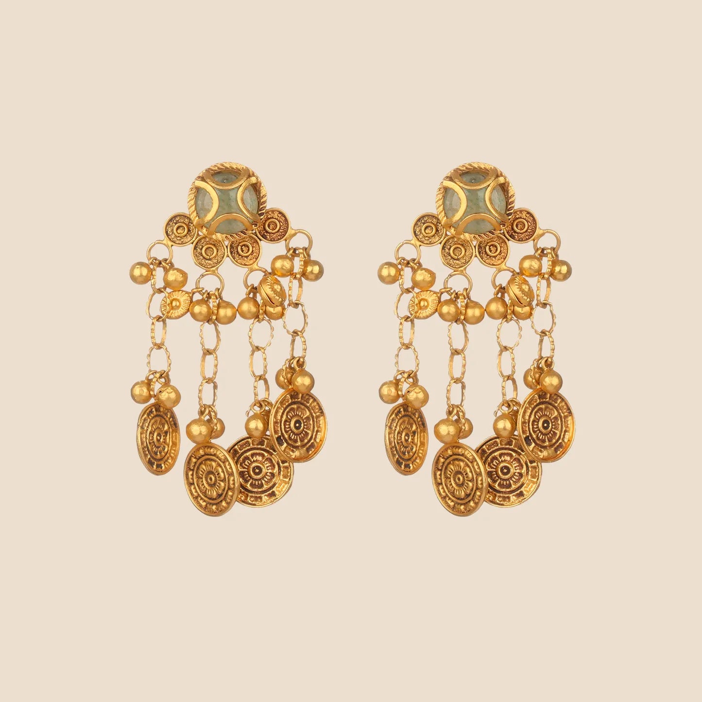 Pair of gold dangle earrings featuring a light green stone top and multiple dangling chains that end in textured gold coin drops.