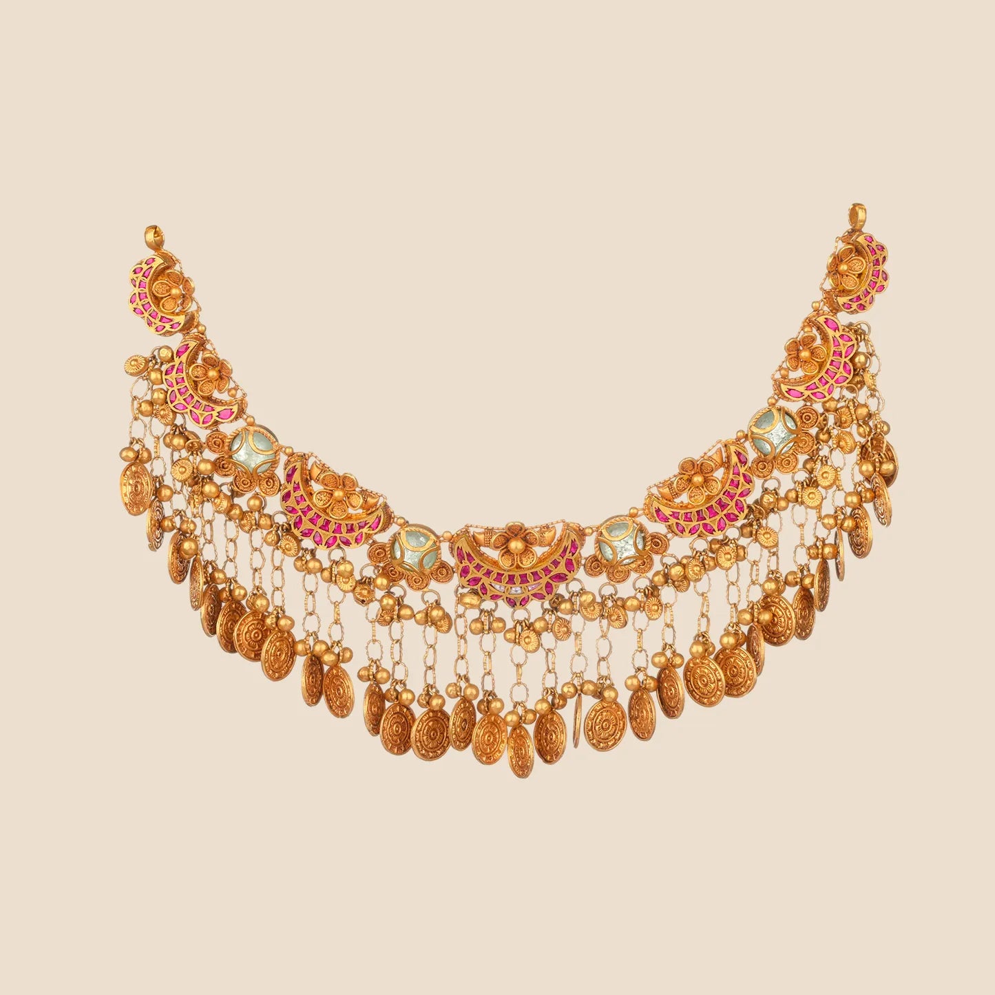 Ornate gold choker necklace detailed with pink stone crescent motifs, pale green stones, and an elaborate cascading fringe of chains ending in textured gold coins.