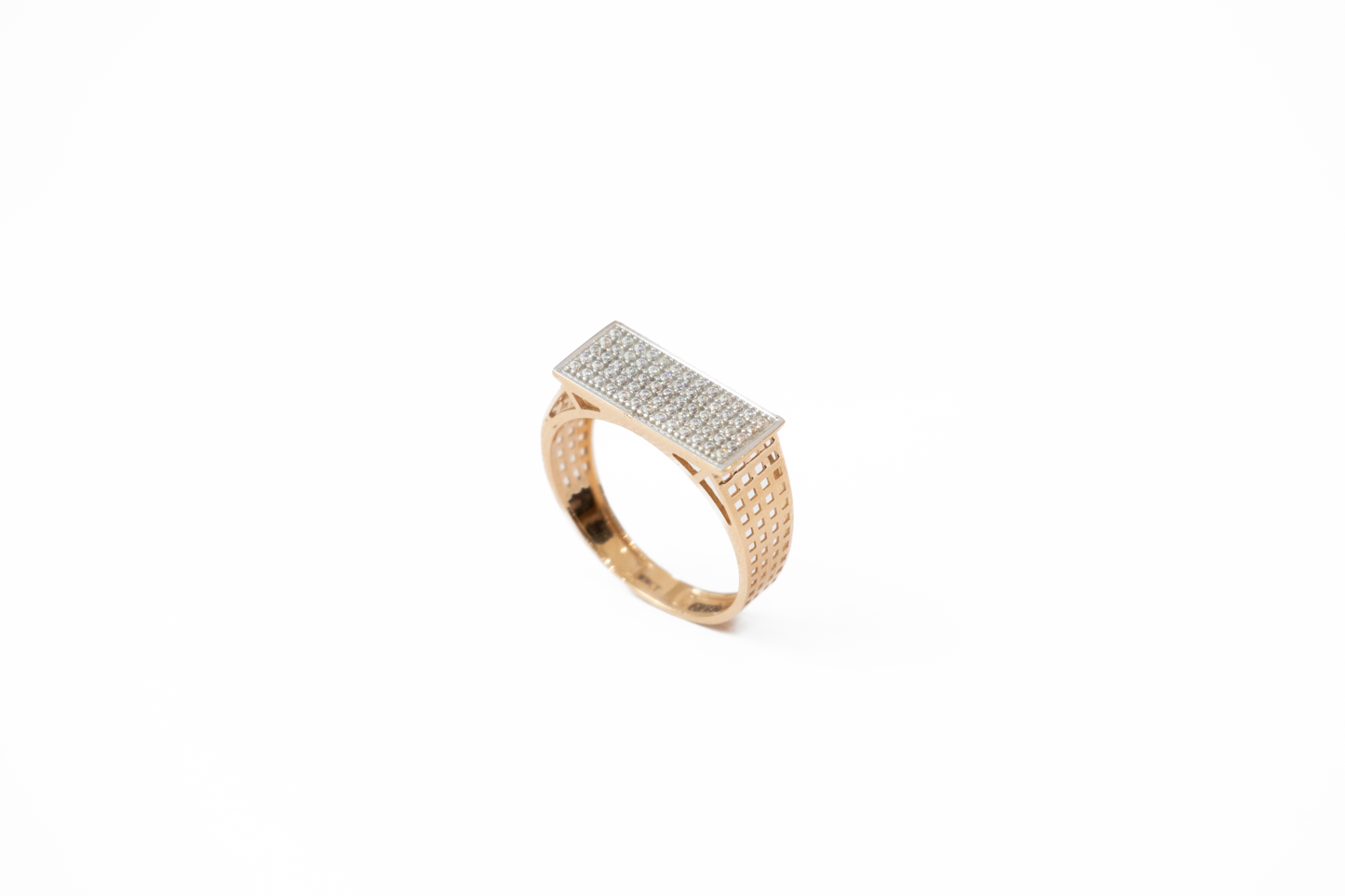 Gold ring with diamond accents on a white background