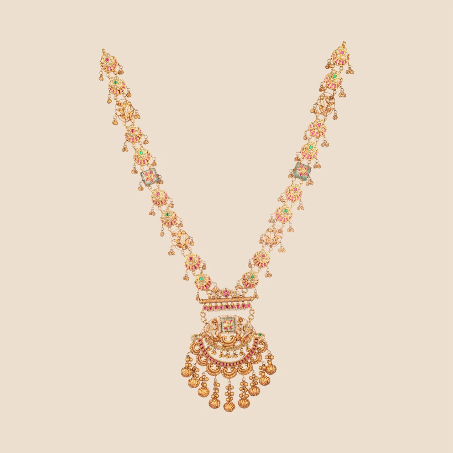 Antique gold long rani haar necklace with alternating kundan and ruby disc motifs, gold ghungroo drops, floral links, and a layered chandelier pendant with textured gold ball tassels.