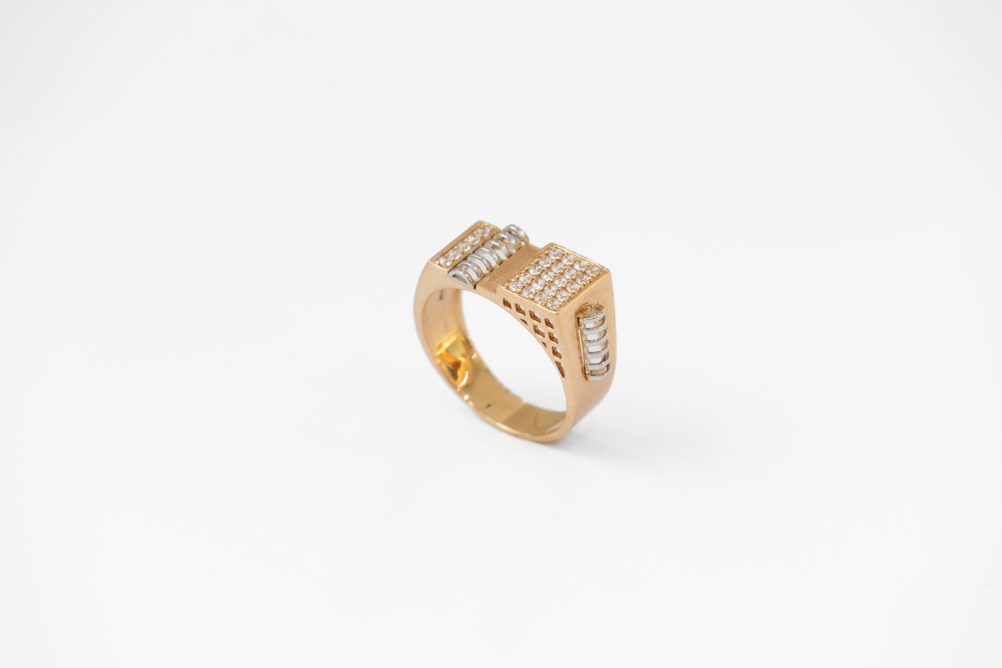 Gold ring with diamond accents on a white background
