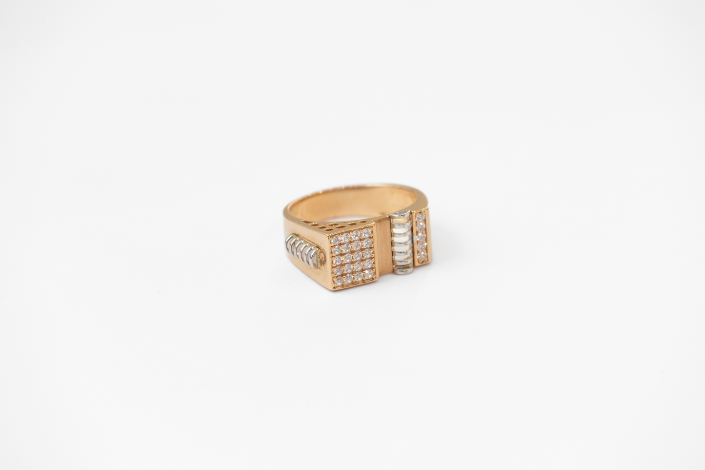 Gold ring with embedded diamonds on a white background