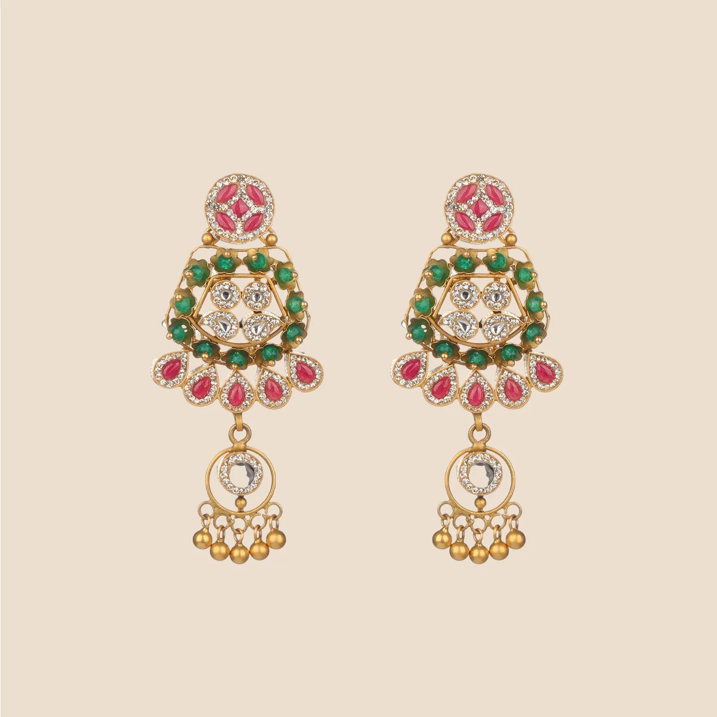 Gold dangle earrings featuring a pink stone stud, green and clear stone filigree, and a fringe of red teardrop stones above a hanging gold charm.