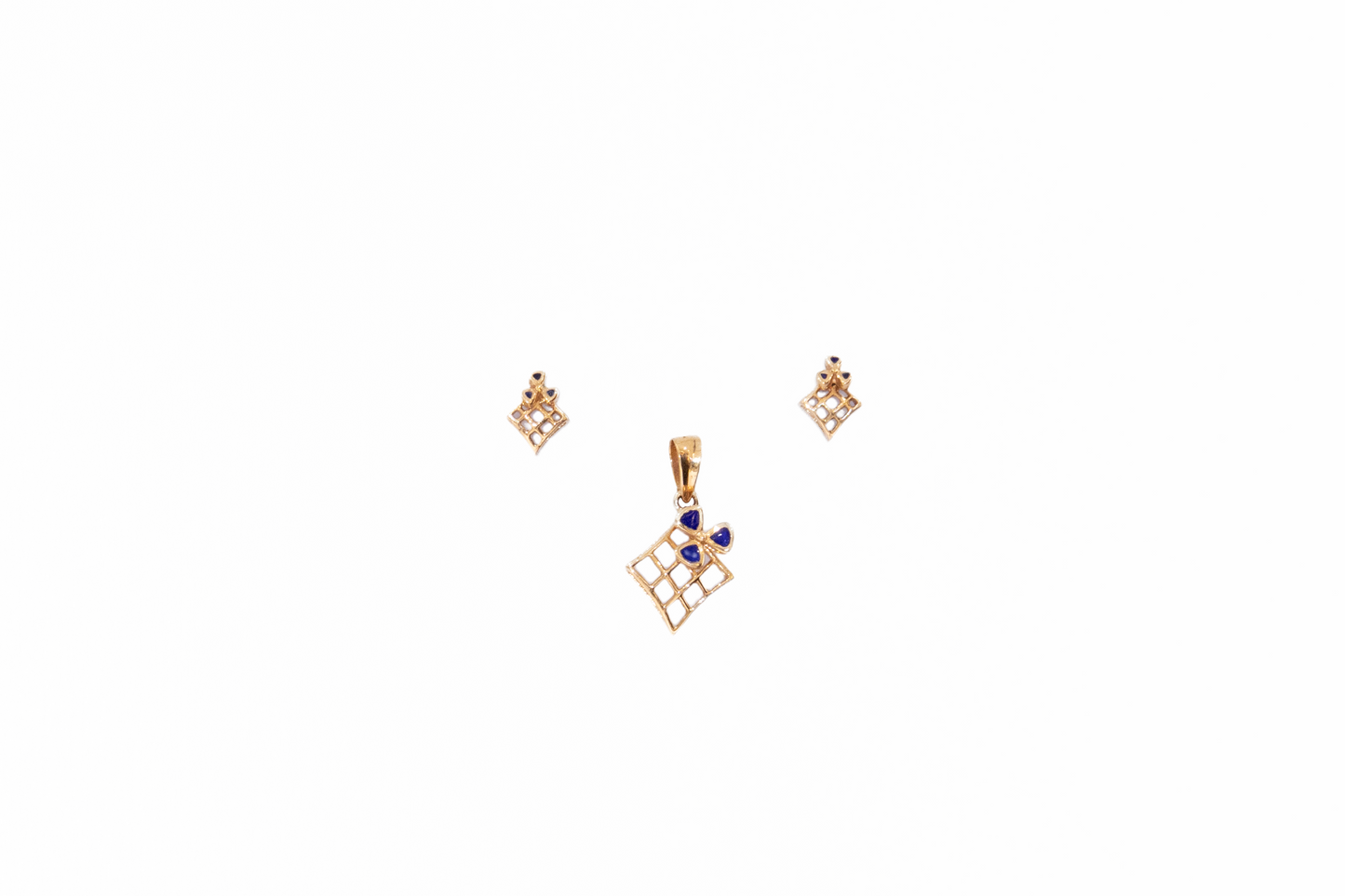 Gold jewelry set with pendant and earrings on a white background