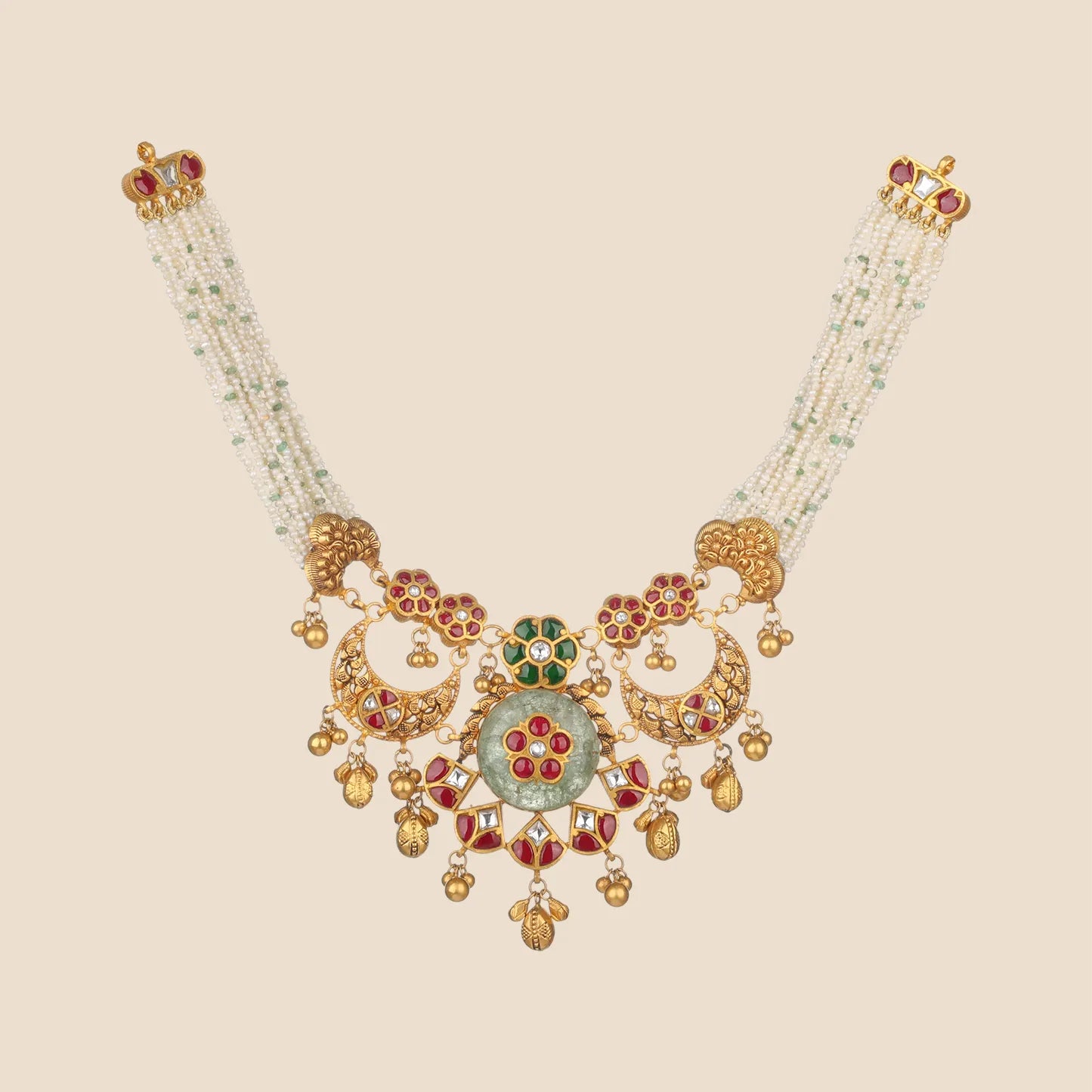 An intricate gold choker necklace featuring a central floral motif with pink gemstones, surrounded by small white pearls and tiered gold dangles.