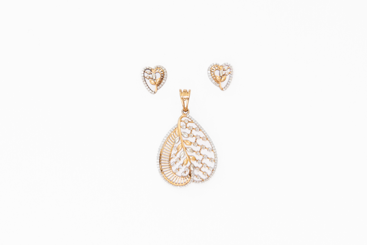 Gold necklace with teardrop pendant and matching earrings on a white background