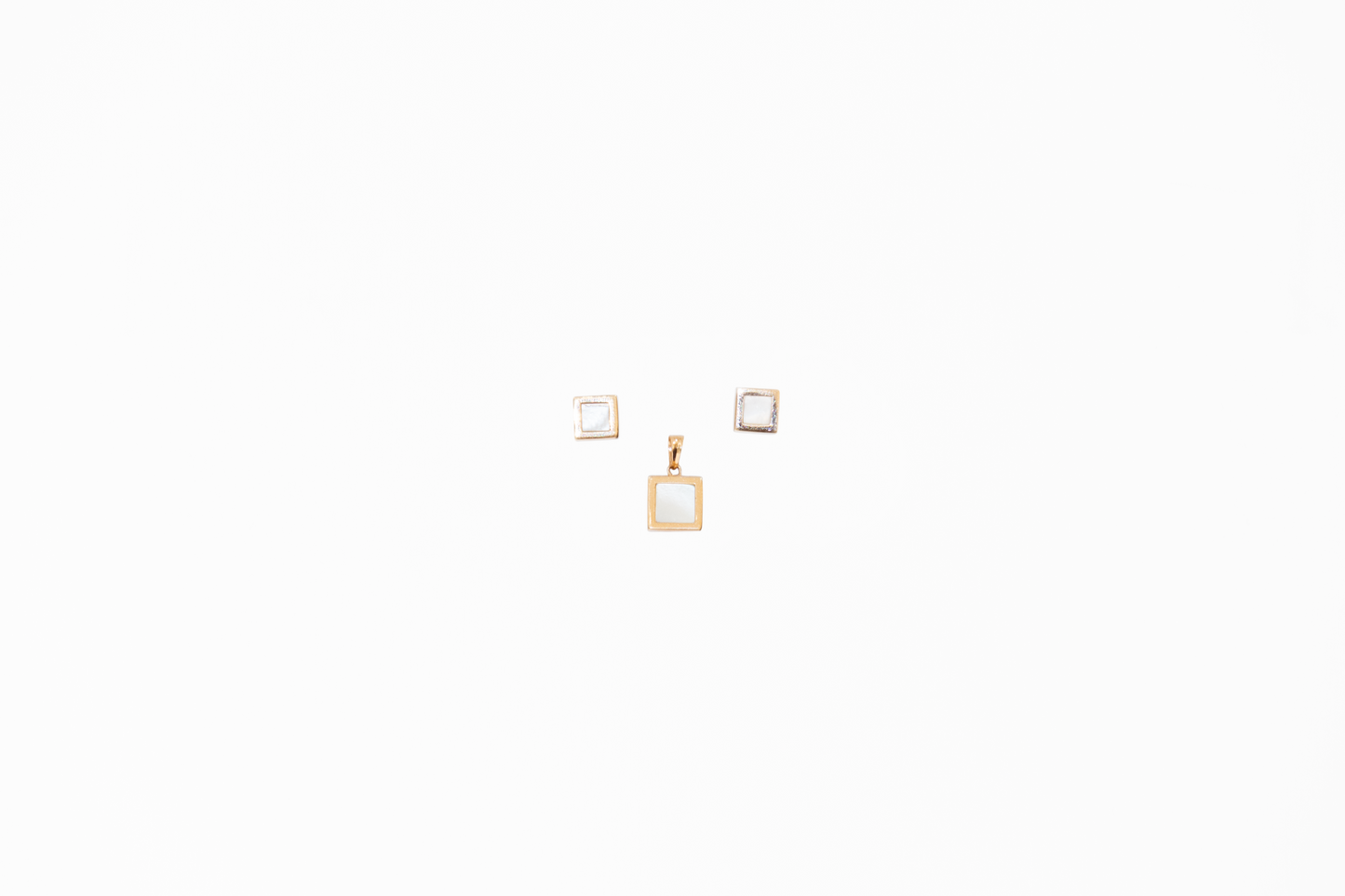 Three square frames with a gold chain on a white background