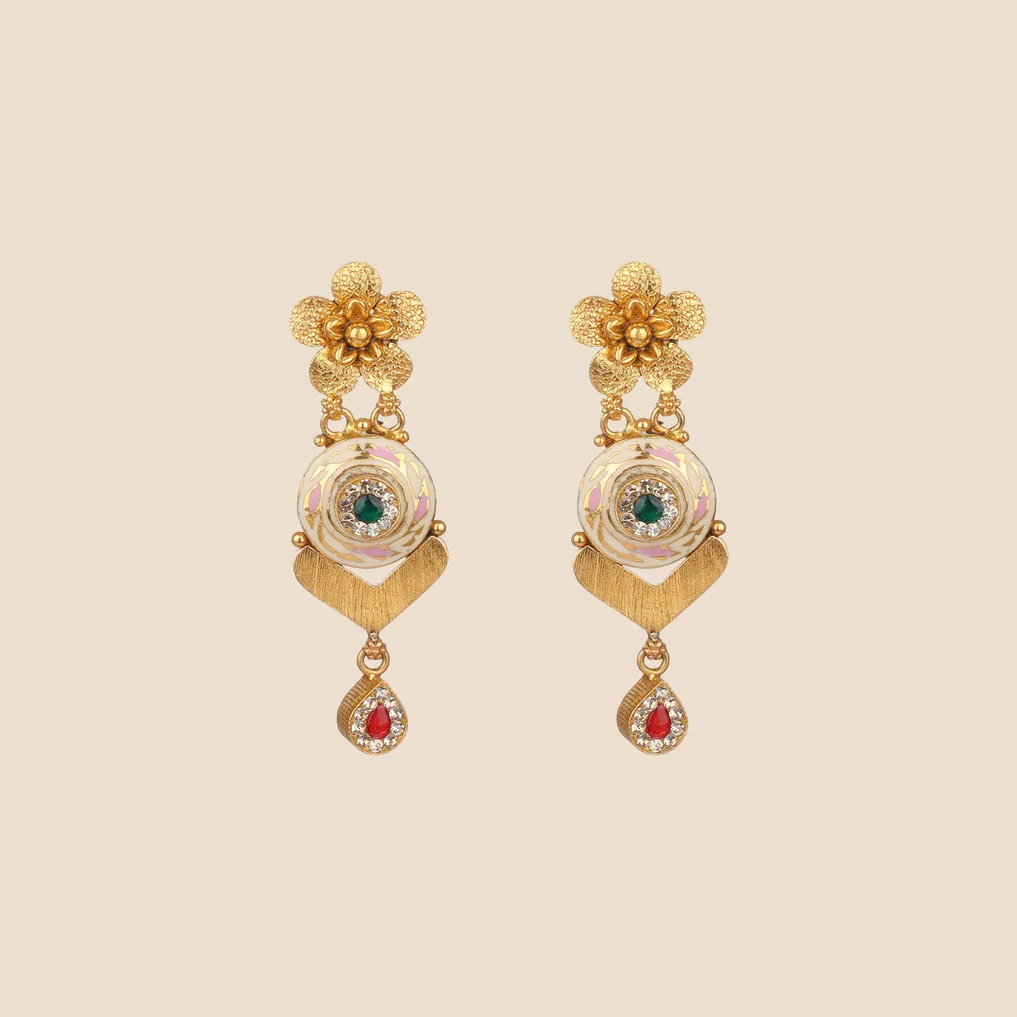 Gold dangle earrings featuring a floral stud, a cream enameled circular motif with a green stone center, and a teardrop dangle with red stone accents.