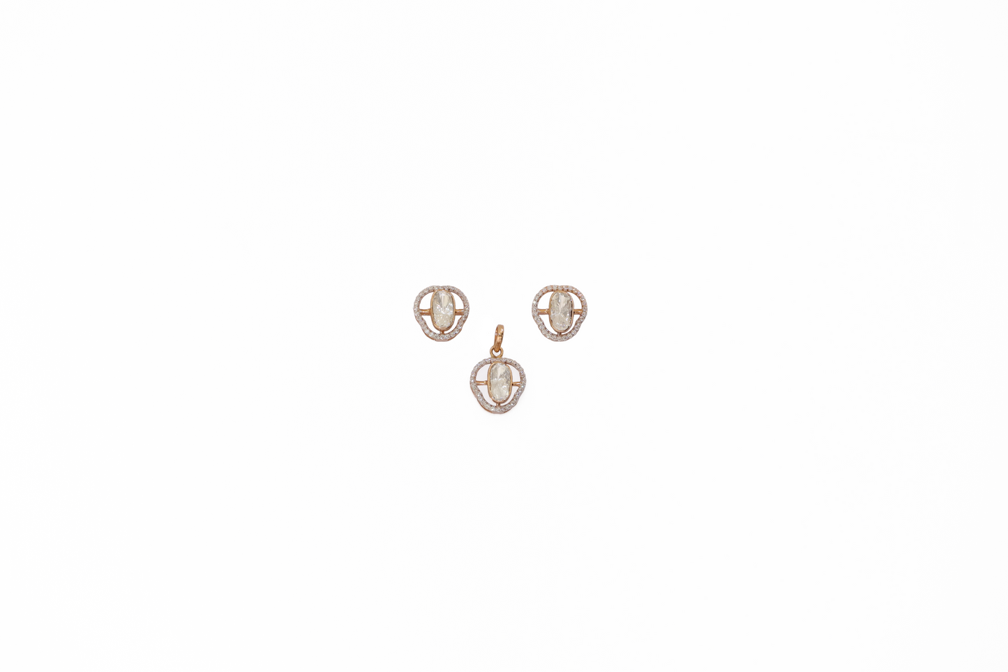 Gold earring set on a white background