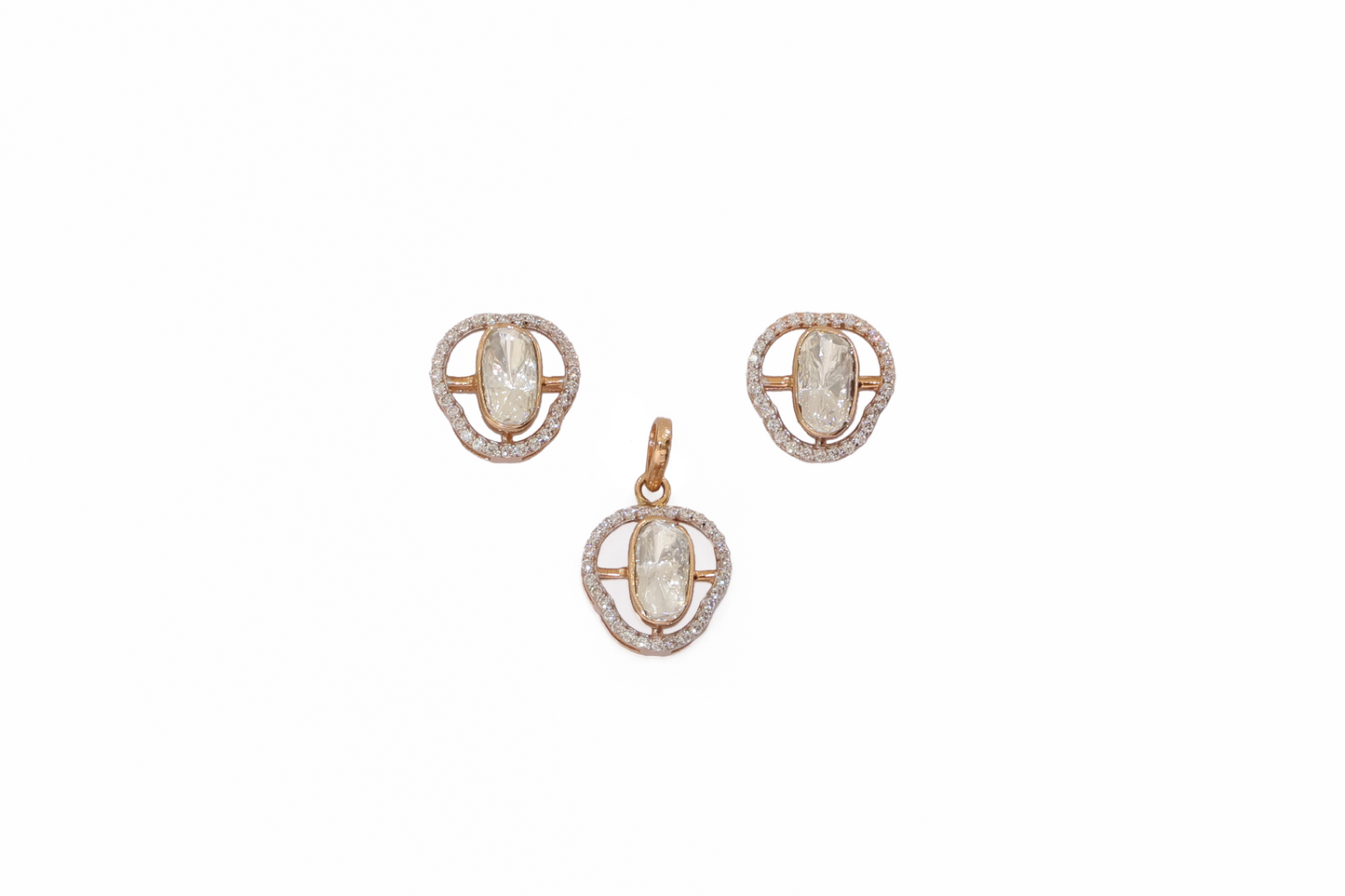 Pair of gold earrings with gemstones on a white background