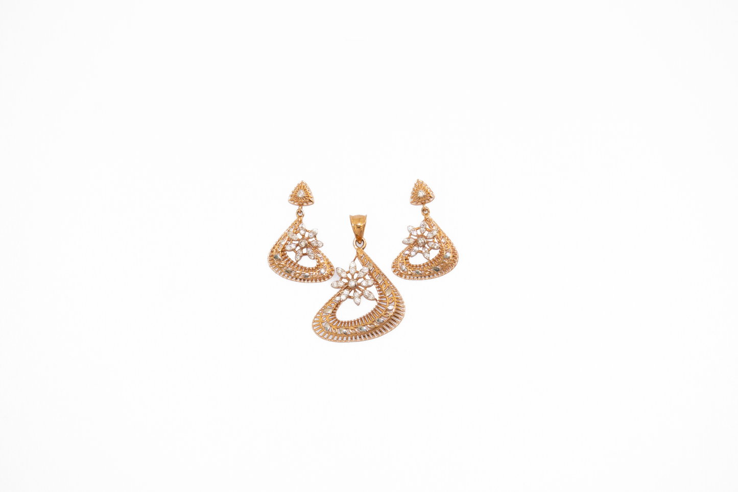 Pair of gold earrings set on a white background