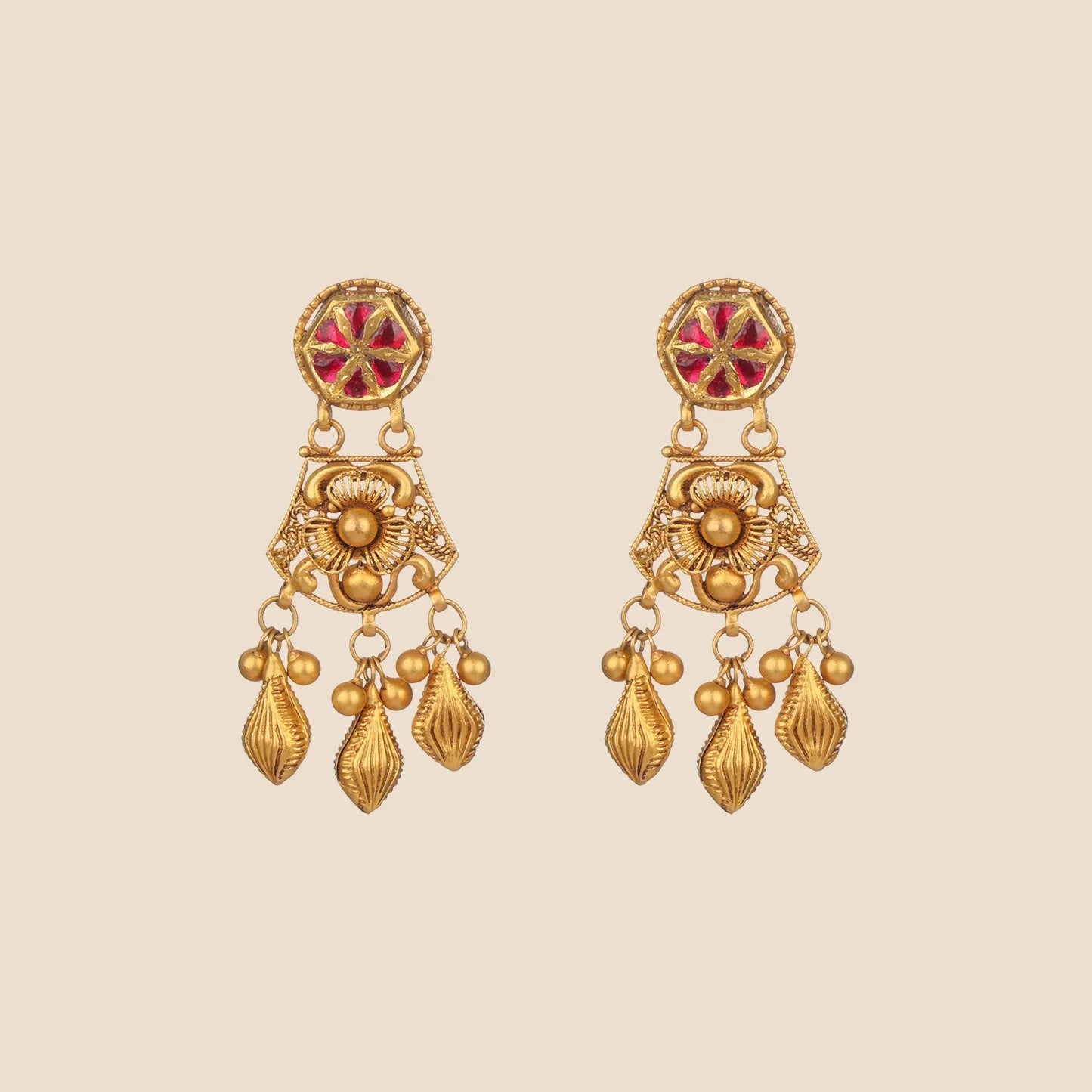 A pair of matching gold drop earrings with red floral studs, central gold flower motifs, and three hanging textured gold droplets.