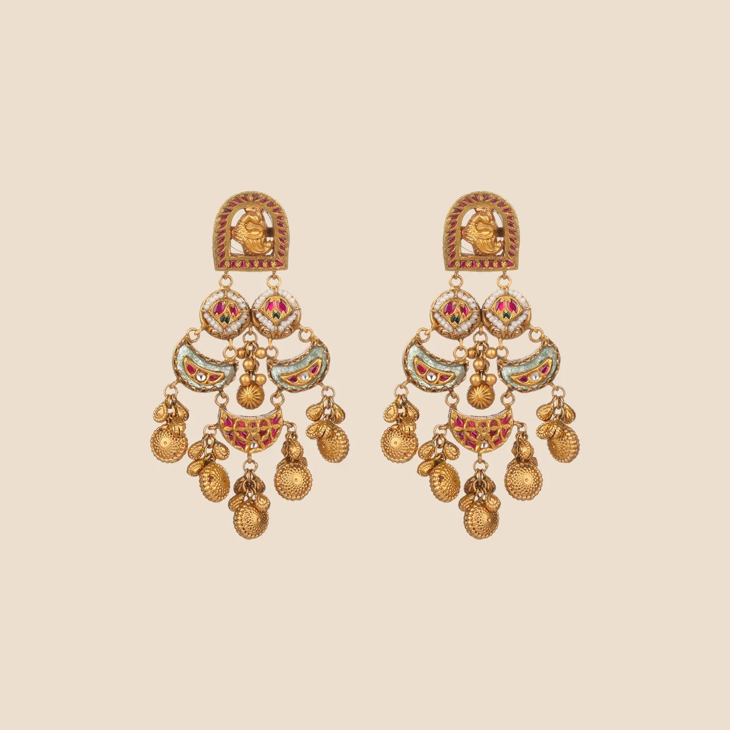 A pair of matching gold drop earrings with mint green circular studs, a central emerald-colored stone, and layered gold leaf dangles.