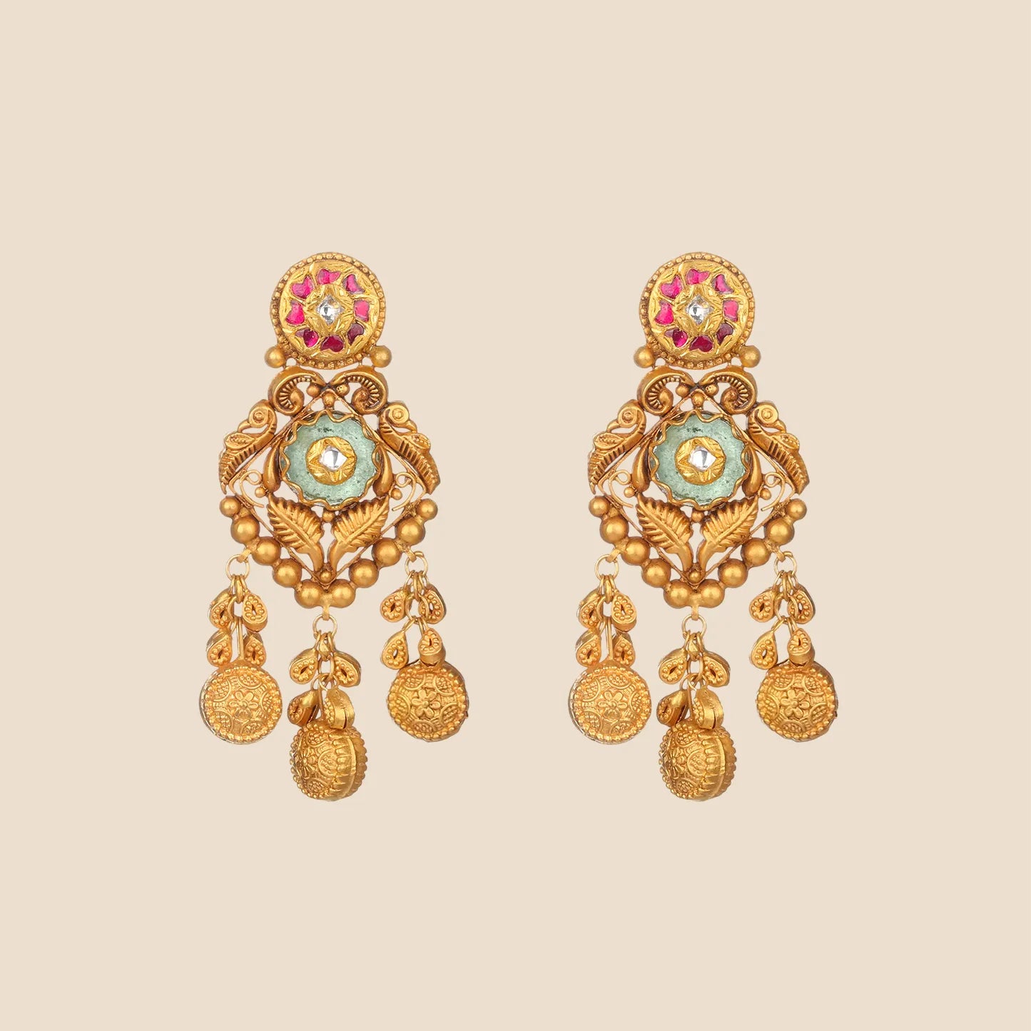 Detailed close-up of a pair of antique-style gold dangle earrings with filigree work, small ruby and kundan stones, stylized parrot motifs, and five coin-shaped danglers.