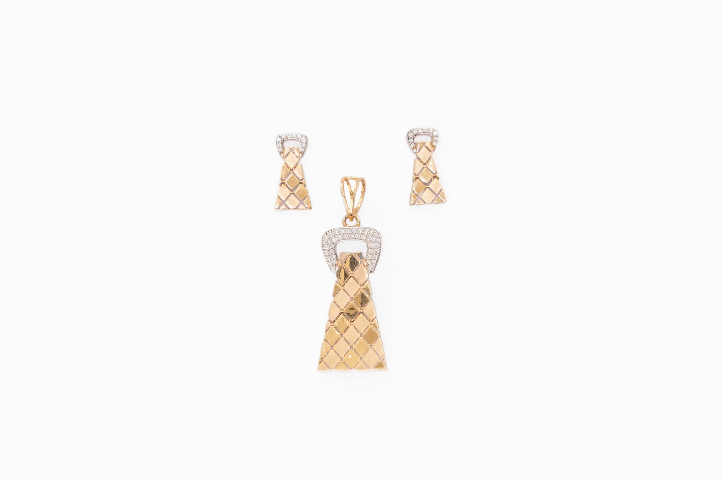 Gold dress-shaped pendant with diamond accents on a white background