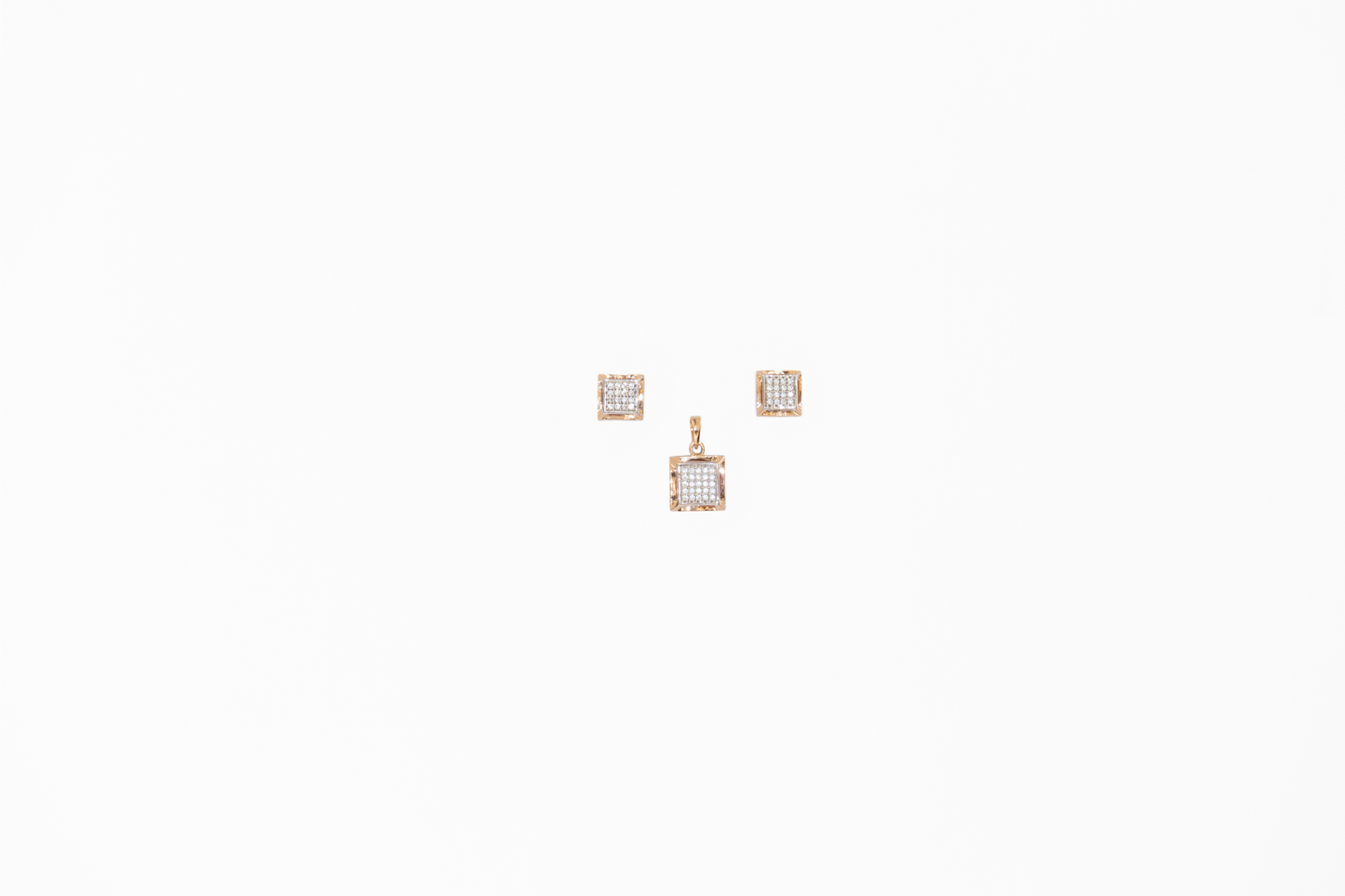 Pair of square-shaped earrings with clear stones on a white background