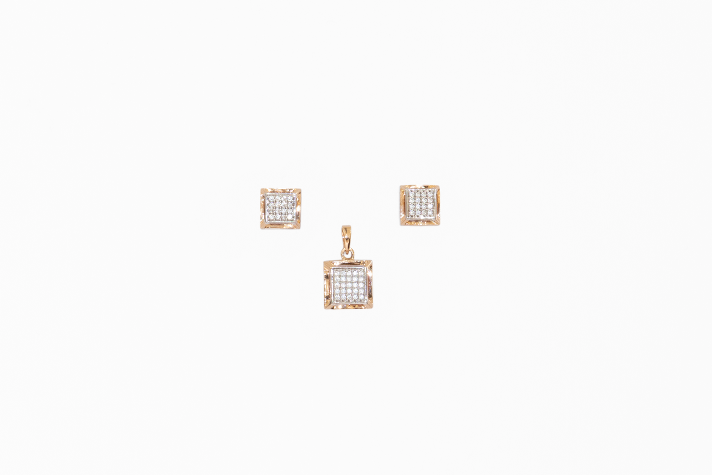 Pair of square-shaped earrings with diamond-like stones on a white background