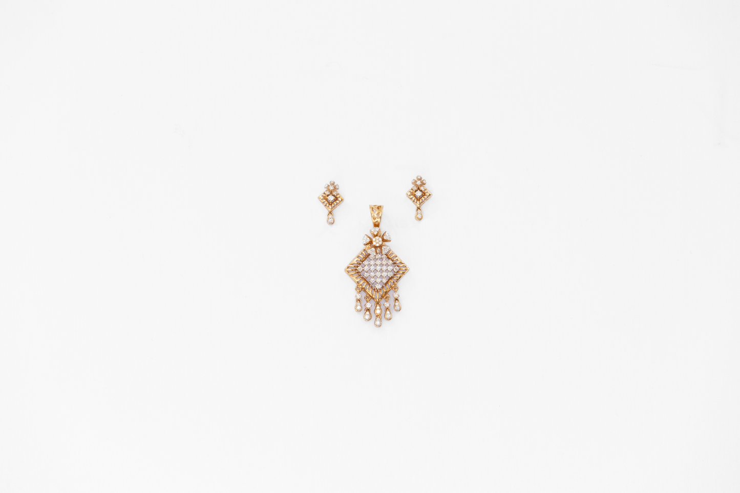 Gold earrings on a white background