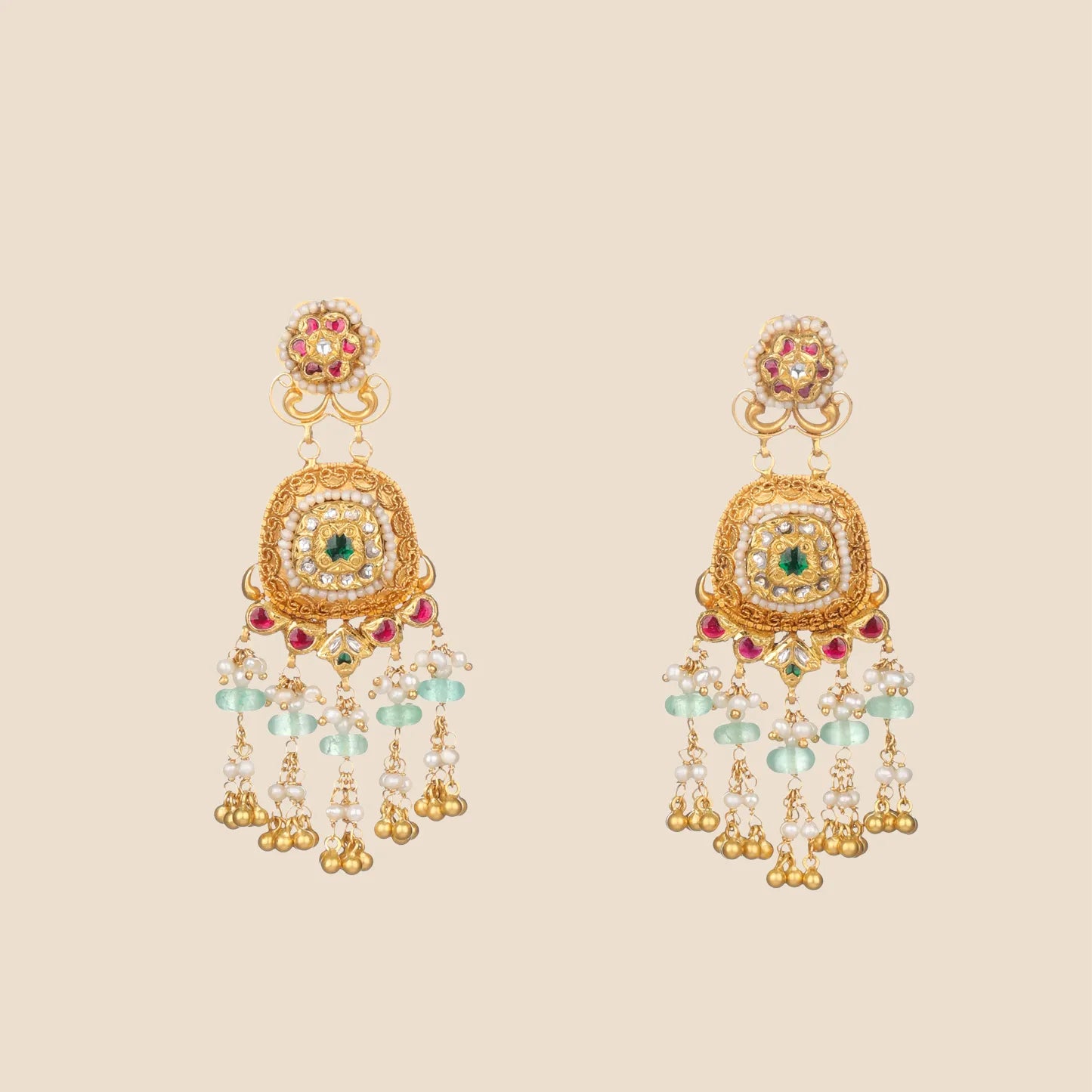 Gold statement earrings with pink, green, and pearl embellishments and dangling bead fringe.
