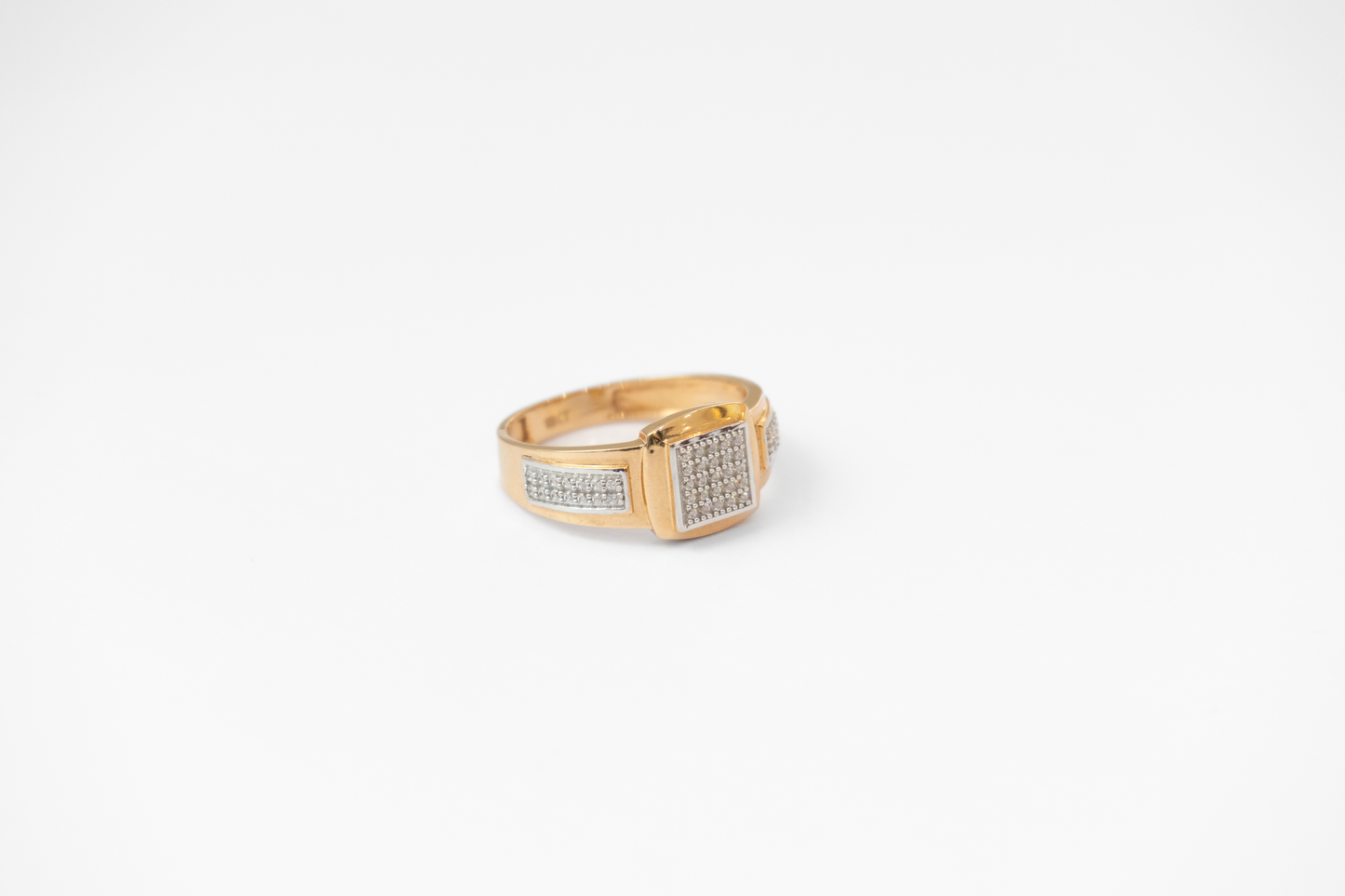 Men Gold ring with diamond accents on a white background