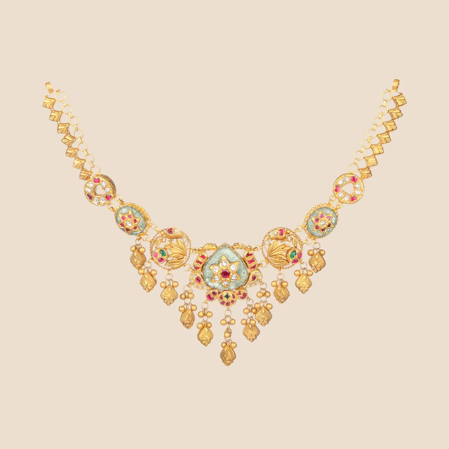 Gold filigree choker with ruby and emerald accents and dangling bead drops.