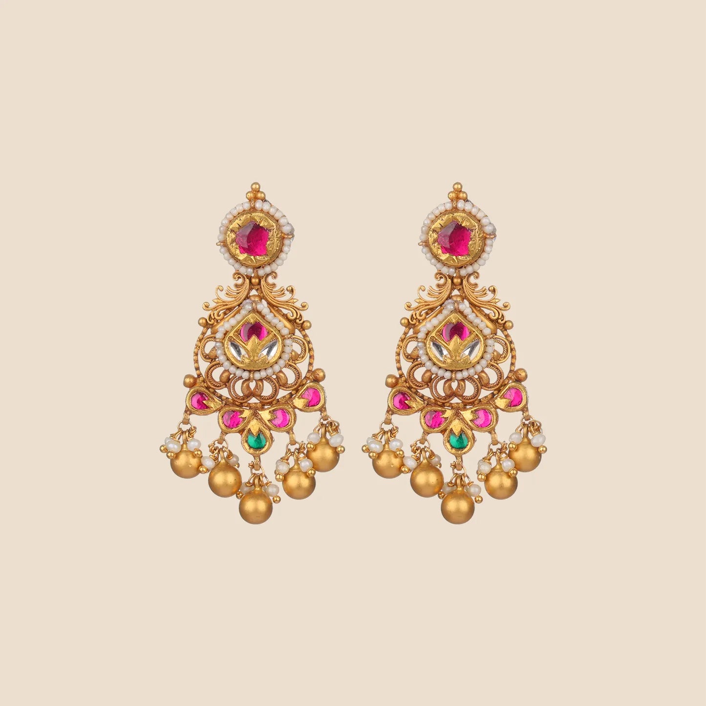 Ornate gold dangle earrings featuring a large pink stone stud bordered by pearls, intricate filigree detailed with pink and clear stones, and a fringe of dangling gold spheres.