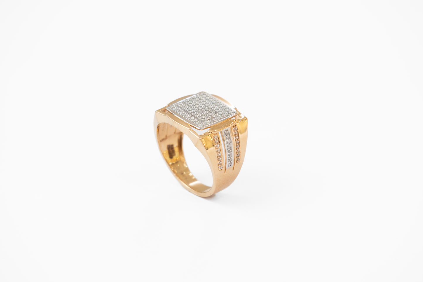 Gold ring with diamond accents on a white background