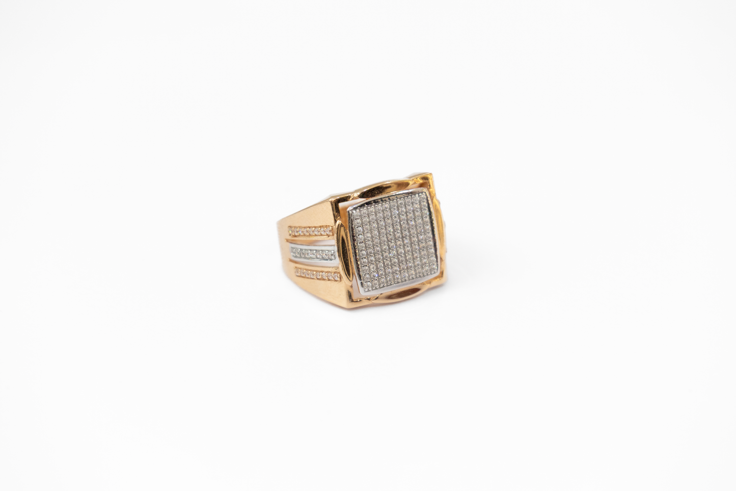 Gold ring with diamond accents on a white background