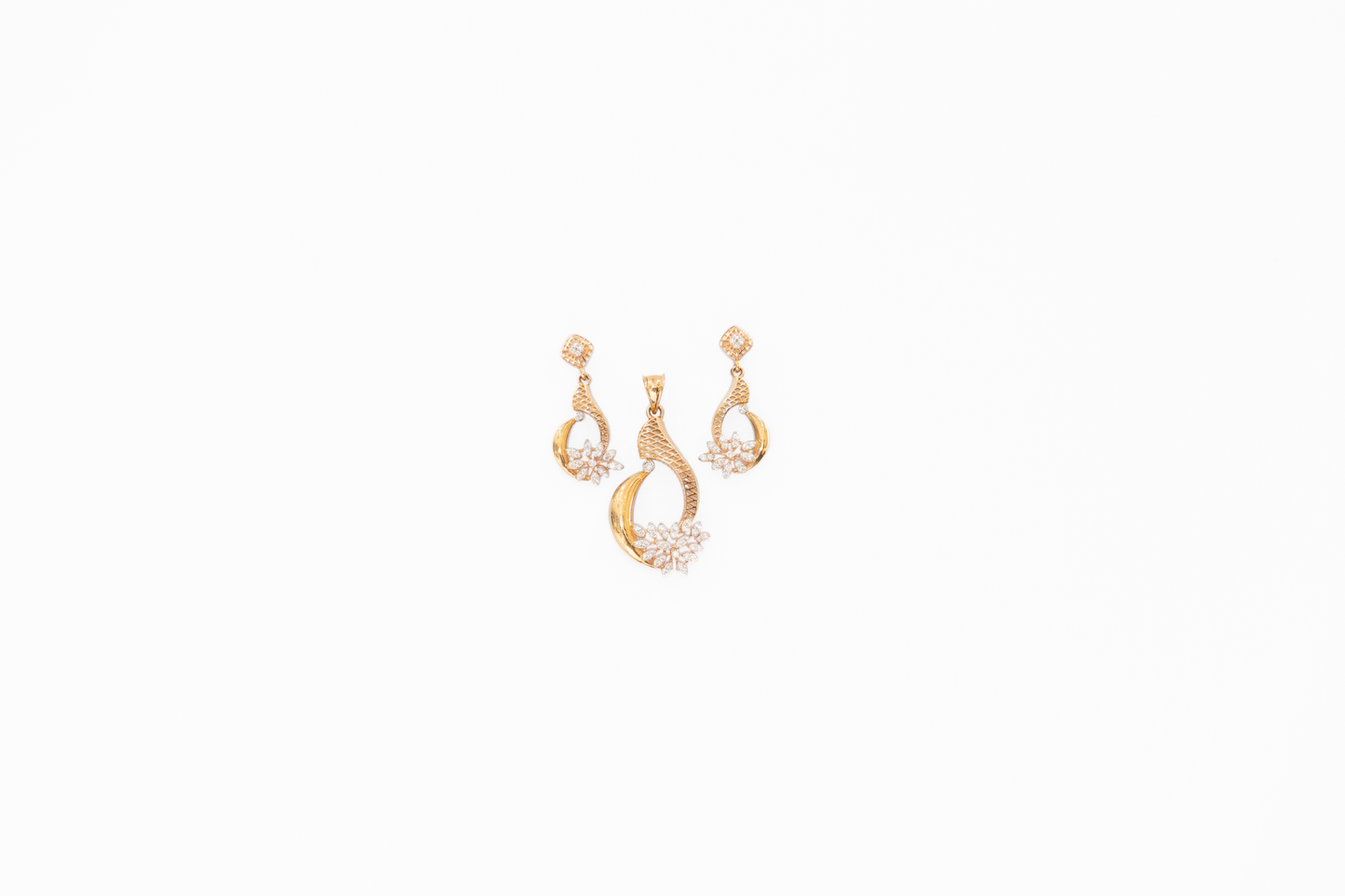 Pair of gold earrings on a white background
