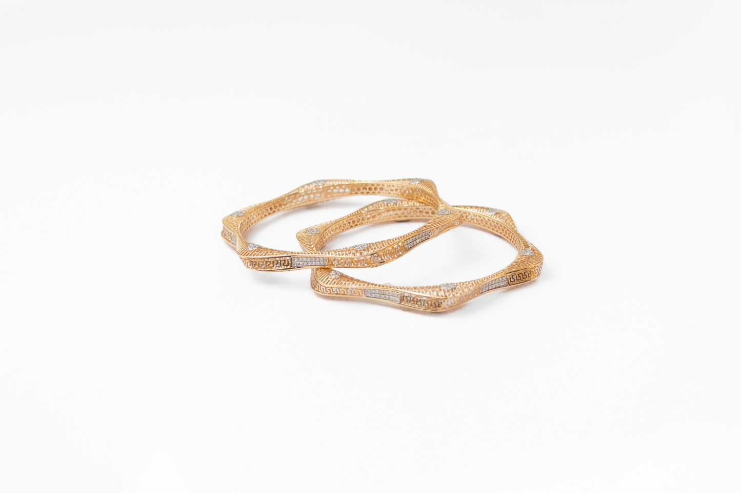 Women Gold bangles on a white background