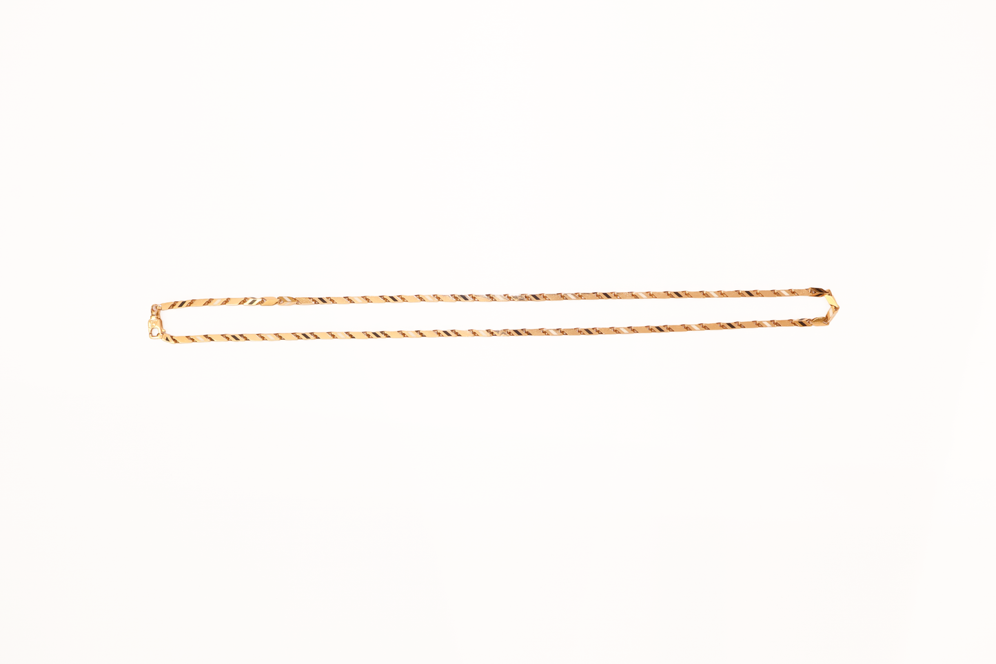 Gold chain on a white background