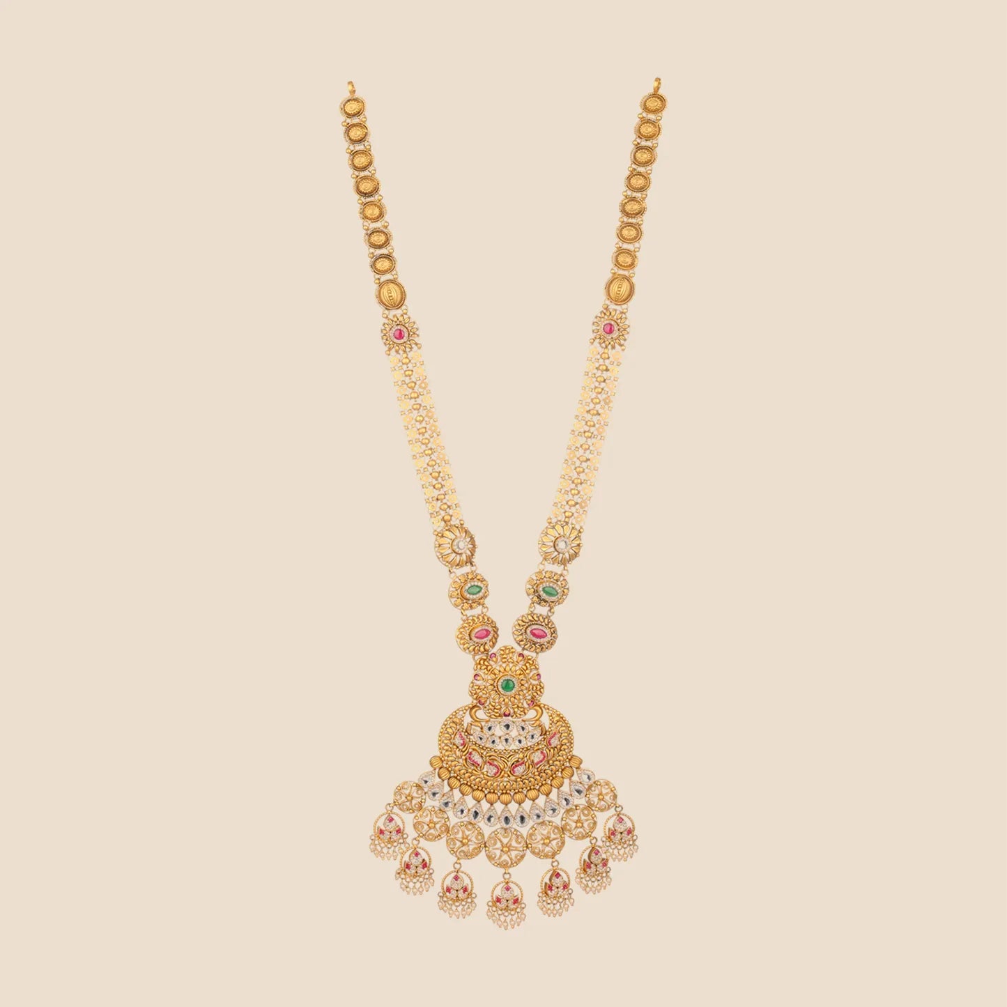 Long gold necklace featuring a multi-strand beaded chain with circular motifs and a large, intricate pendant detailed with pink and green stones and a cascading fringe of pearl drops.