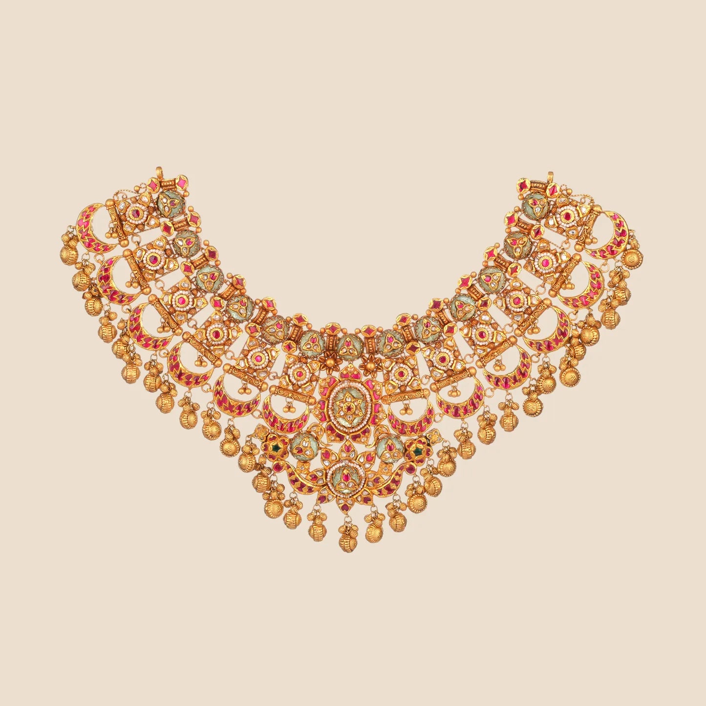 Heavy vintage-style gold choker necklace detailed with repeating crescent motifs, green and pink stones, pearl accents, and cascading gold drops.